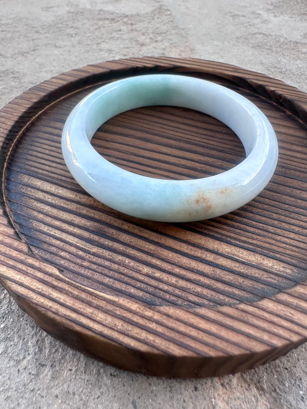 Icy White-Green Jadeite Bangle with Natural Sajin (Sz 52.5)