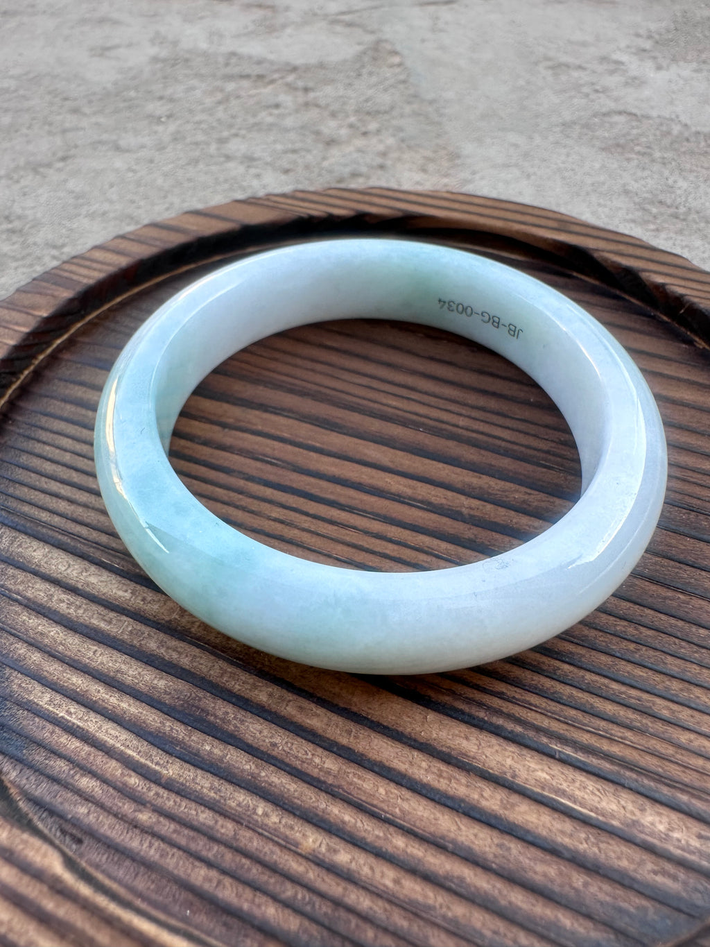 Icy White-Green Jadeite Bangle with Natural Sajin (Sz 52.5)